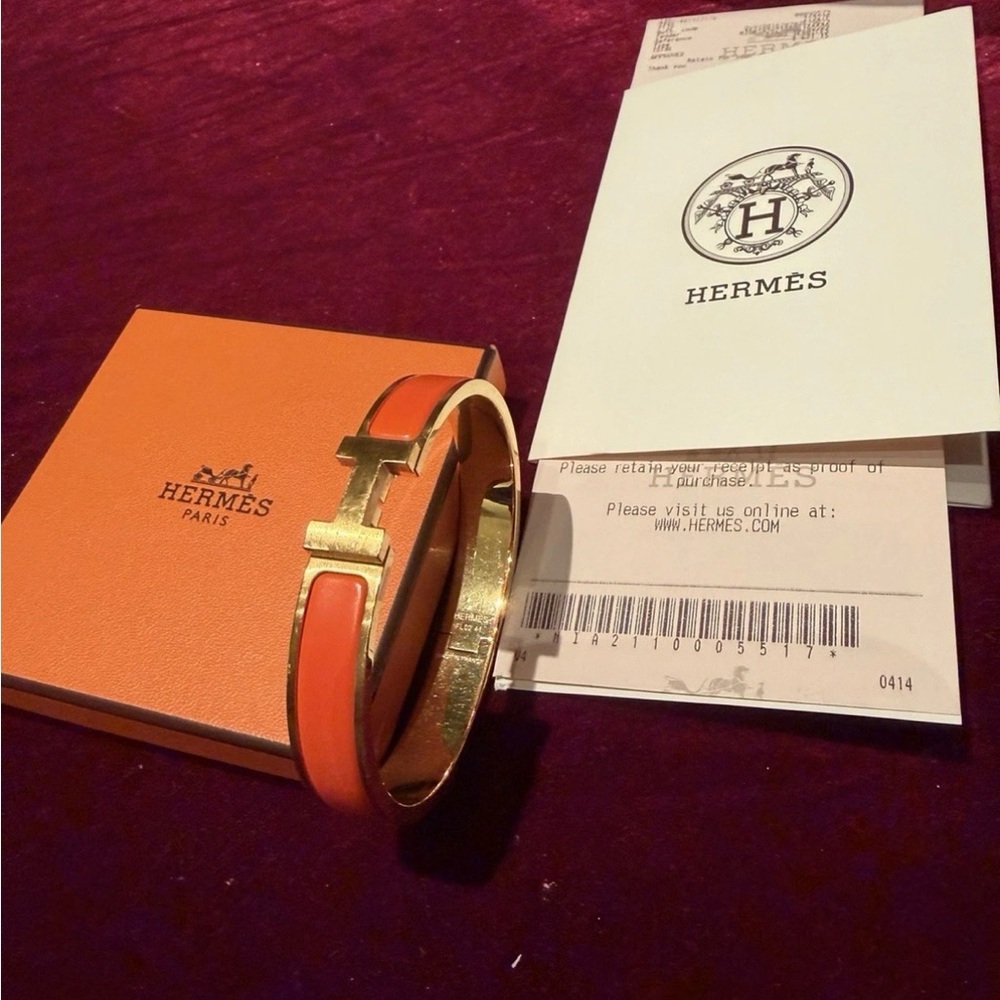 Hermès Orange and Gold clic clac bracelet